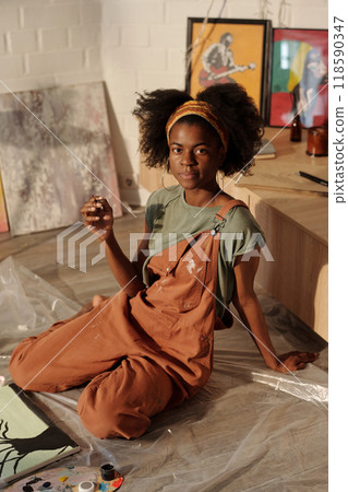 Creative Young Artist Painting in Studio 118590347