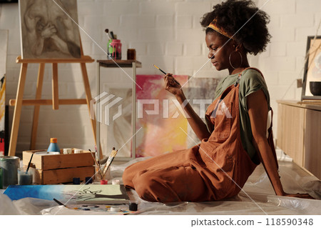 Painting Artwork Sitting on Floor in Art Studio 118590348