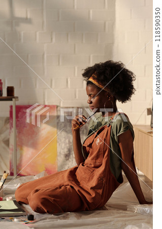 Relaxing and Painting in Cozy, Sunlit Room 118590350