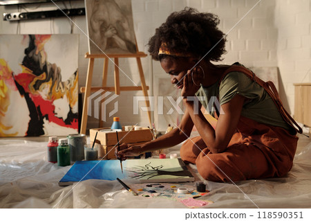 Painting Artist Creating Artwork in Studio Painting Artist Creating Artwork in Studio 118590351