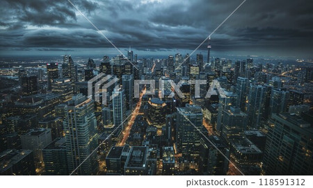 A stunning aerial view of a vibrant city at night under a cloudy sky 118591312