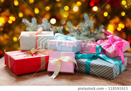 Christmas gift boxes and fir tree branches Christmas gift boxes and fir tree branches 118591915