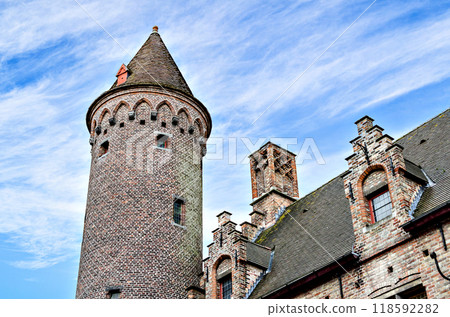Bruges, Belgium; view of the medieval buildings that are crossed by the canals of the city. Historic center World Heritage	 118592282