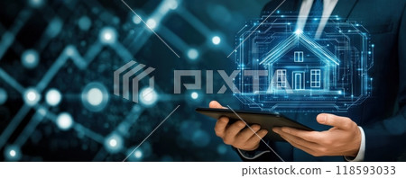 Businessman holding a tablet with a glowing house hologram, symbolizing modern technology in real estate and innovation concepts. 118593033