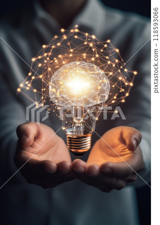 Business professional holding an illuminated light bulb representing innovation and new ideas in a dark background setting 118593066
