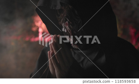 Monk With monster face Praying for Soul in the night forest for Halloween 118593658
