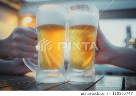 Cheers to a summer beer garden! Enjoy ice-cold beer Cheers to a summer beer garden! Enjoy ice-cold beer 118593747