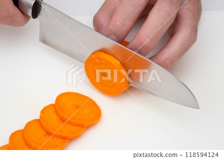 Cut the carrots into round slices Cut the carrots into round slices 118594124