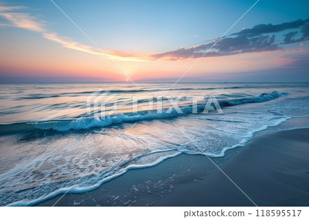 Pastel sunset over calm ocean waves 118595517