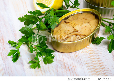 Canned tuna fish on a wooden table 118596558