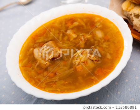 Soup of cabbage with boiled vegetables, pork broth and sour cream Soup of cabbage with boiled vegetables, pork broth and sour cream 118596891