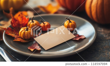 Autumnal Table Setting with Mini Pumpkins and Blank Card 118597094
