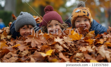 Three Smiling Children Hiding In Autumn Leaves 118597660