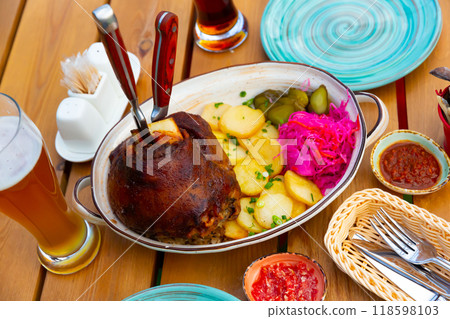 German pork hock with sliced potato and marinaded foods German pork hock with sliced potato and marinaded foods 118598103