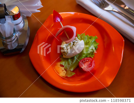 Ship-shaped stuffed egg with salad and sausage for kids Ship-shaped stuffed egg with salad and sausage for kids 118598371