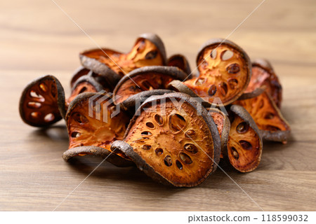Dried Bael fruit on wooden background, Herbal drink ingredient 118599032
