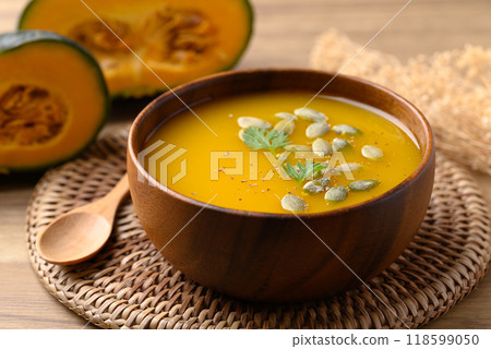 Pumpkin soup in wooden bowl, Homemade food in autumn season 118599050