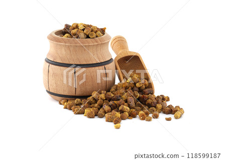 Bee bread in a rustic wooden barrel with a small wooden scoop on white background Bee bread in a rustic wooden barrel with a small wooden scoop on white background 118599187