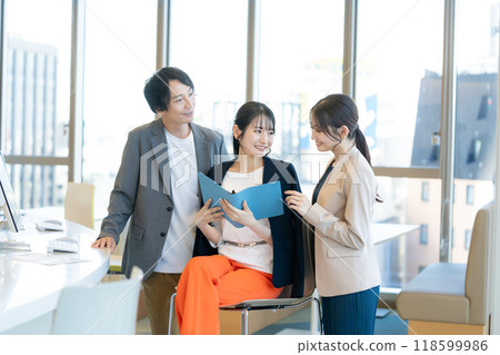 Business people working in an office. Photo courtesy of Denpa Gakuen, Tokyo Electronics College. 118599986