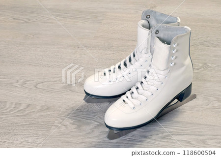 White old skates close-up. Figure skating, winter sport and hobby sports.  118600504