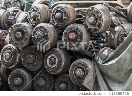 Old car axles and Many undercarriage parts at second hand parts car shop. 118600736