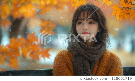 Stylish young woman gazing at autumn leaves Stylish young woman gazing at autumn leaves 118601719
