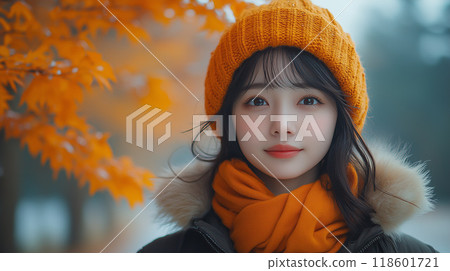 Stylish young woman gazing at autumn leaves Stylish young woman gazing at autumn leaves 118601721