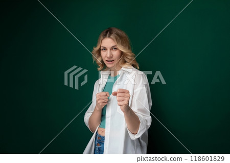 Woman Standing in Front of Green Wall 118601829