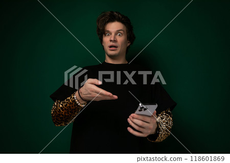 Man in Black Shirt Holding Cell Phone 118601869