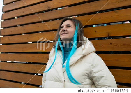Woman With Blue Hair Standing in Front of Wooden Wall 118601894