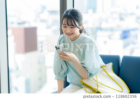 A young woman operating a smartphone. Photo courtesy of Denpa Gakuen, Tokyo Electronics College. A young woman operating a smartphone. Photo courtesy of Denpa Gakuen, Tokyo Electronics College. 118602356