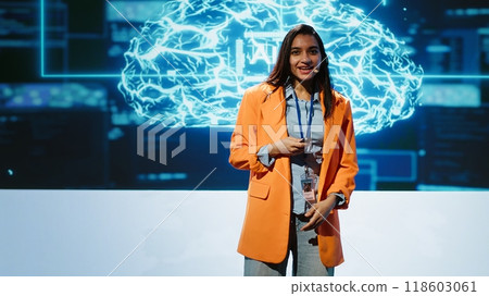 Lively speaker talks at AI event gathering tech startups managers, investors and academics. Expert hosts sessions geared towards helping IT business leaders tap into artificial intelligence, camera A 118603061