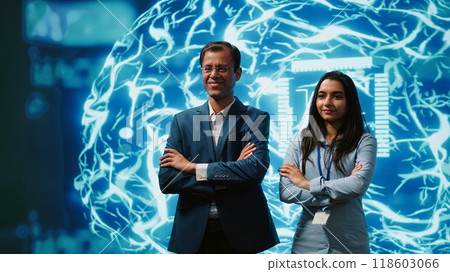 Admins using artificial intelligence computing simulating human brain thought processes in computerized model. Portrait of employees working with AI machine learning algorithms, camera A Admins using artificial intelligence computing simulating human brain thought processes in computerized model. Portrait of employees working with AI machine learning algorithms, camera A 118603066