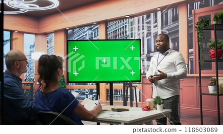 Senior people meeting with a financial adviser about pension plans, using mockup copy space on laptop. Expert and clients exploring financial options for future investments. Camera B. 118603089