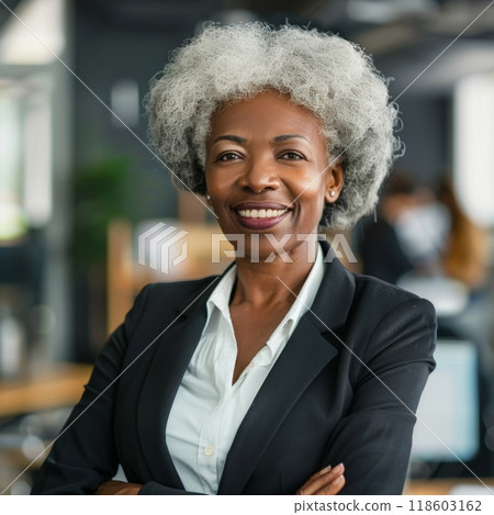 Smiling African American businesswoman 50-60 years old, active business woman against the background of her office 118603162