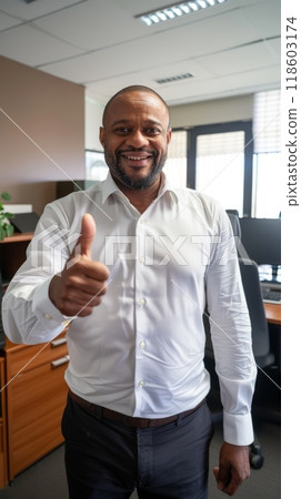 African American businessman showing thumbs up in his office, success and achievement concept 118603174