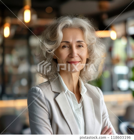 Smiling European businesswoman 50-60 years old, active business woman against the background of her office 118603196