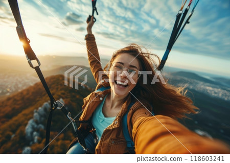 Happy paragliders flying on a paraglider, experienced pilots smiling at the camera 118603241