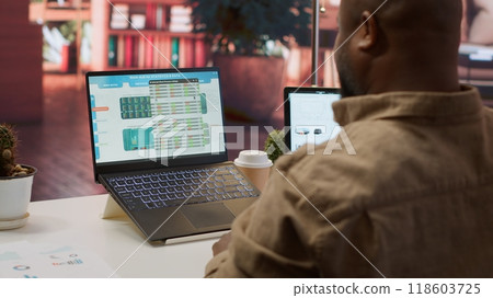 Entrepreneur calculating expenses with online invoices on laptop, creating an analytics reports plan for investment strategy. Working on increasing budget for business expansion. Camera A. Entrepreneur calculating expenses with online invoices on laptop, creating an analytics reports plan for investment strategy. Working on increasing budget for business expansion. Camera A. 118603725