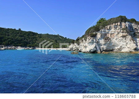 Beautiful beach with sea and clear water. The Greek island of Antipaxos. Concept for travel and summer vacation. 118603788