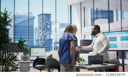 Senior citizens greeting banker to explore various retirement planning options, ensuring they make informed decisions about future financial stability. Consulting a financial advisor. Camera B. Senior citizens greeting banker to explore various retirement planning options, ensuring they make informed decisions about future financial stability. Consulting a financial advisor. Camera B. 118603874