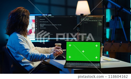 Admin using green screen laptop to implement security measures, protecting company systems and data. IT worker testing and debugging code for software applications on chroma key notebook, camera A Admin using green screen laptop to implement security measures, protecting company systems and data. IT worker testing and debugging code for software applications on chroma key notebook, camera A 118604162