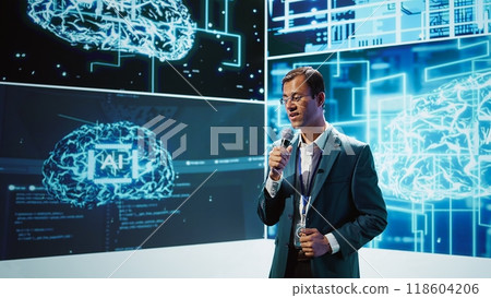 Speaker does presentation during tech conference, exploring successful implementation of AI in driving forward startup businesses, sharing latest machine learning discoveries, camera B 118604206