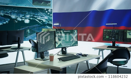 Empty russian army command center with a big screen showing the national flag, working on spreading fake news and propaganda to inflict fear and misinformation. Terrorist ideology. Camera B. 118604232