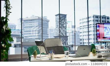 Empty global corporation office in a luxurious urban city center, modern workspace equipped with professional tools and networking system. Career development and motivation. 118604372