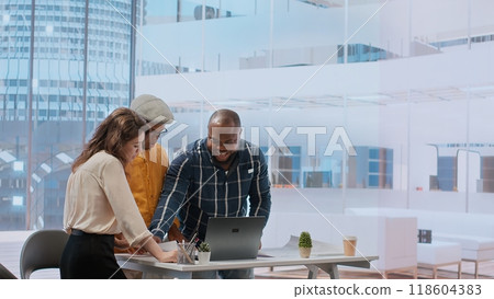 Business owner exchanging ideas with realtor and contractor during an office tour, real estate agents securing a new leasing contract with an entrepreneur. Reaching a rental agreement. Camera B. 118604383
