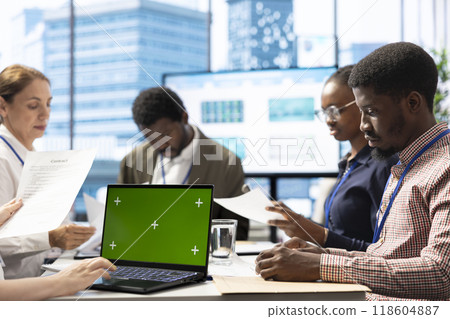 Investors group gathering in a meeting with chroma key screen on pc, discussing about potential business expansion plans. Examining reports to do another investment, corporate briefing. Investors group gathering in a meeting with chroma key screen on pc, discussing about potential business expansion plans. Examining reports to do another investment, corporate briefing. 118604887