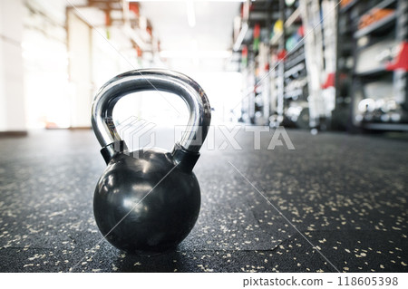 Kettlebells on floor in gym. Gym equipment for strength training. 118605398
