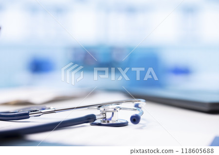 Spacious and empty healthcare office with modern medical equipment, designed for patient care and treatment. Emphasizing the importance of examinations with a stethoscope. Close up. Spacious and empty healthcare office with modern medical equipment, designed for patient care and treatment. Emphasizing the importance of examinations with a stethoscope. Close up. 118605688
