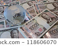 A large amount of new 10,000 yen bills and a glass globe A large amount of new 10,000 yen bills and a glass globe 118606070